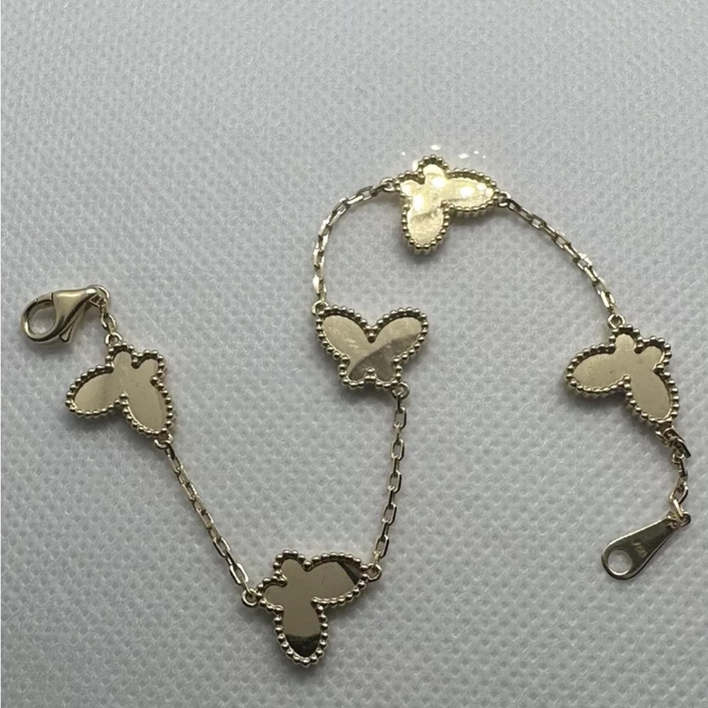 Solid gold 18 k gold butterfly bracelet mirror polished.Made in Italy.